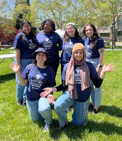 Group of 6 student pose outdoors